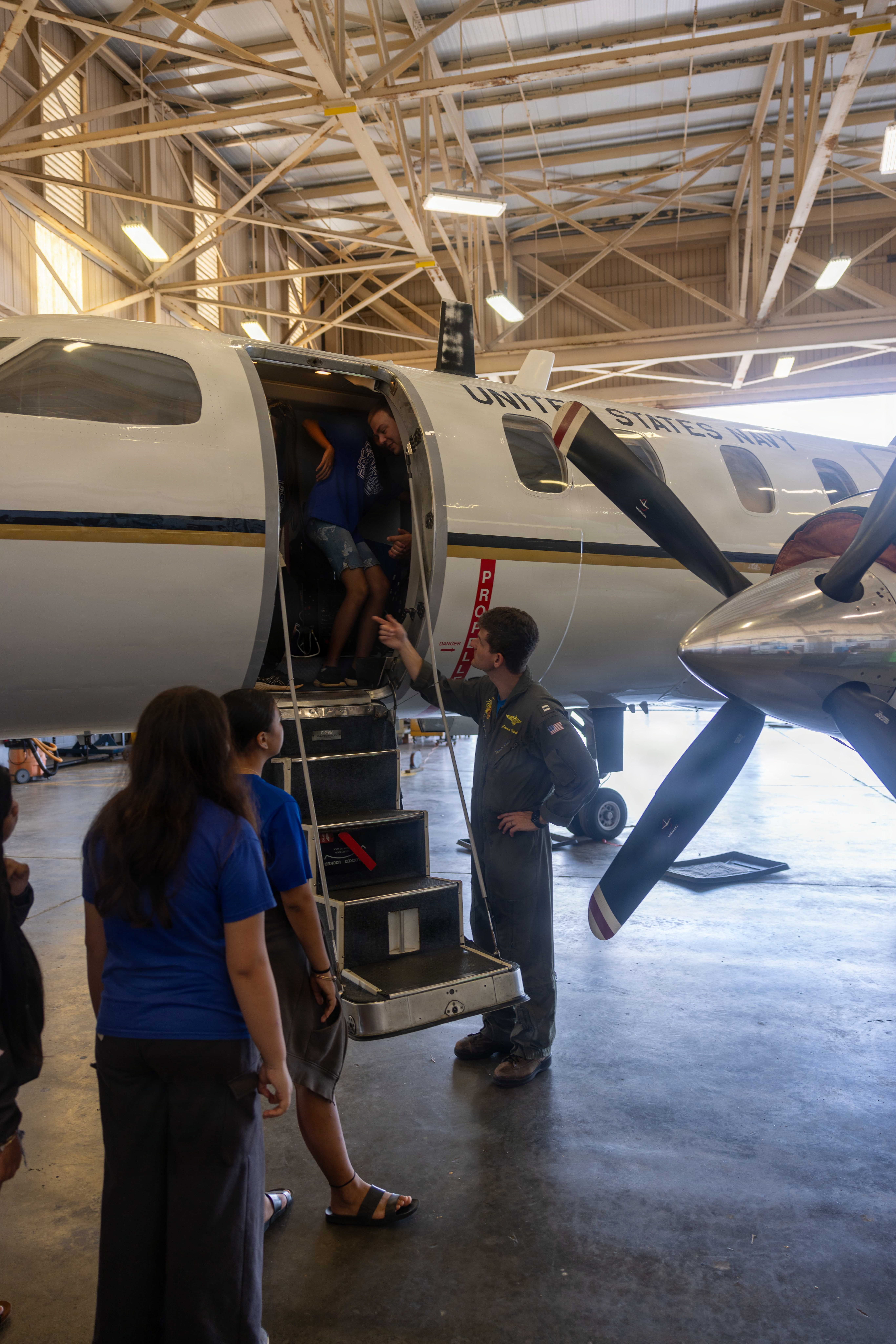 Lt. Ramzi Garvin teaches students about his aircraft.